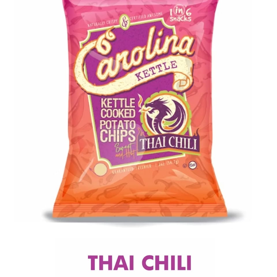 Carolina Kettle Thai Chili potato chips bag, pink and orange with a dragon logo.